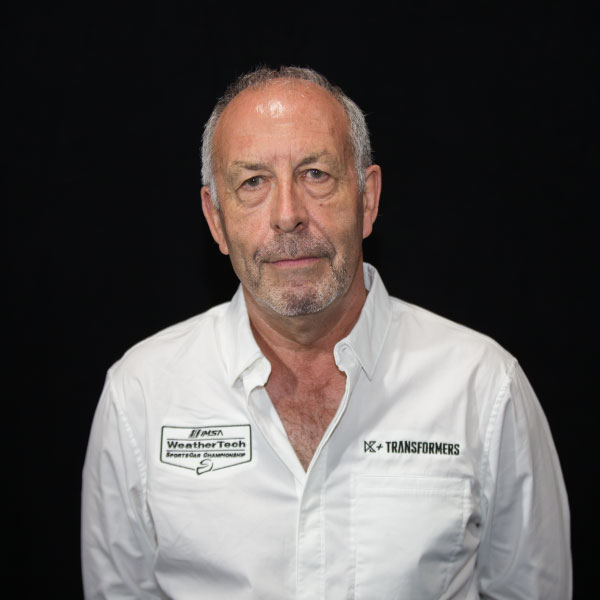 A man in white shirt and black background